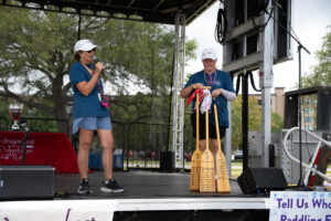 Two Dragon Boat members on stage at the 2024 Dragon Boat Festival