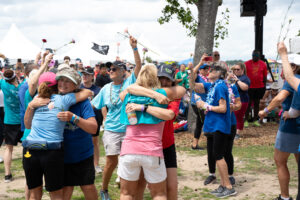 Group of people hugging at 2024 Dragon Boat Fesitval