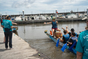 Dragon boat in the water next to the dock