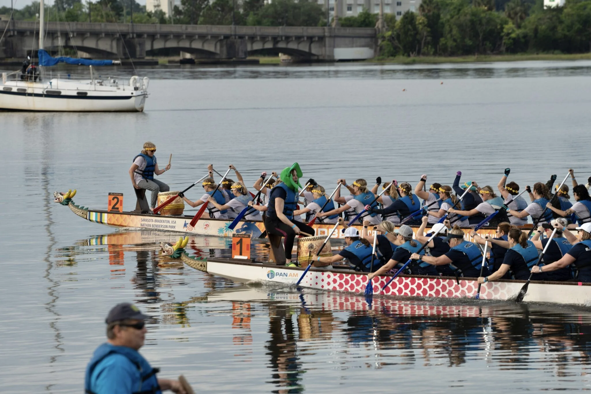 Two dragon boats racing in the water