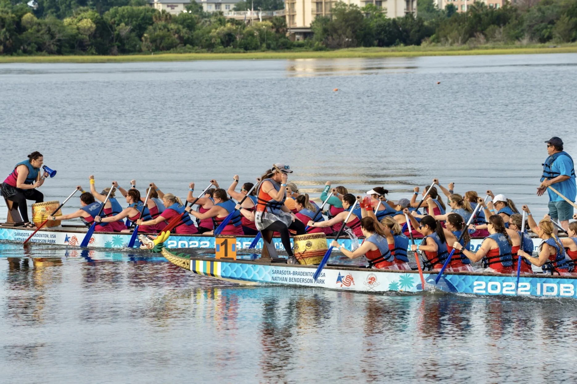 Two dragon boats racing in the water